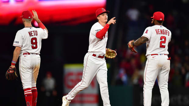 Jun 9, 2023; Anaheim, California, USA; Los Angeles Angels shortstop Zach Neto (9) right fielder Mickey Moniak (16) and second baseman Luis Rengifo (2) celebrate the victory against the Seattle Mariners at Angel Stadium. Mandatory Credit: Gary A. Vasquez-USA TODAY Sports  
